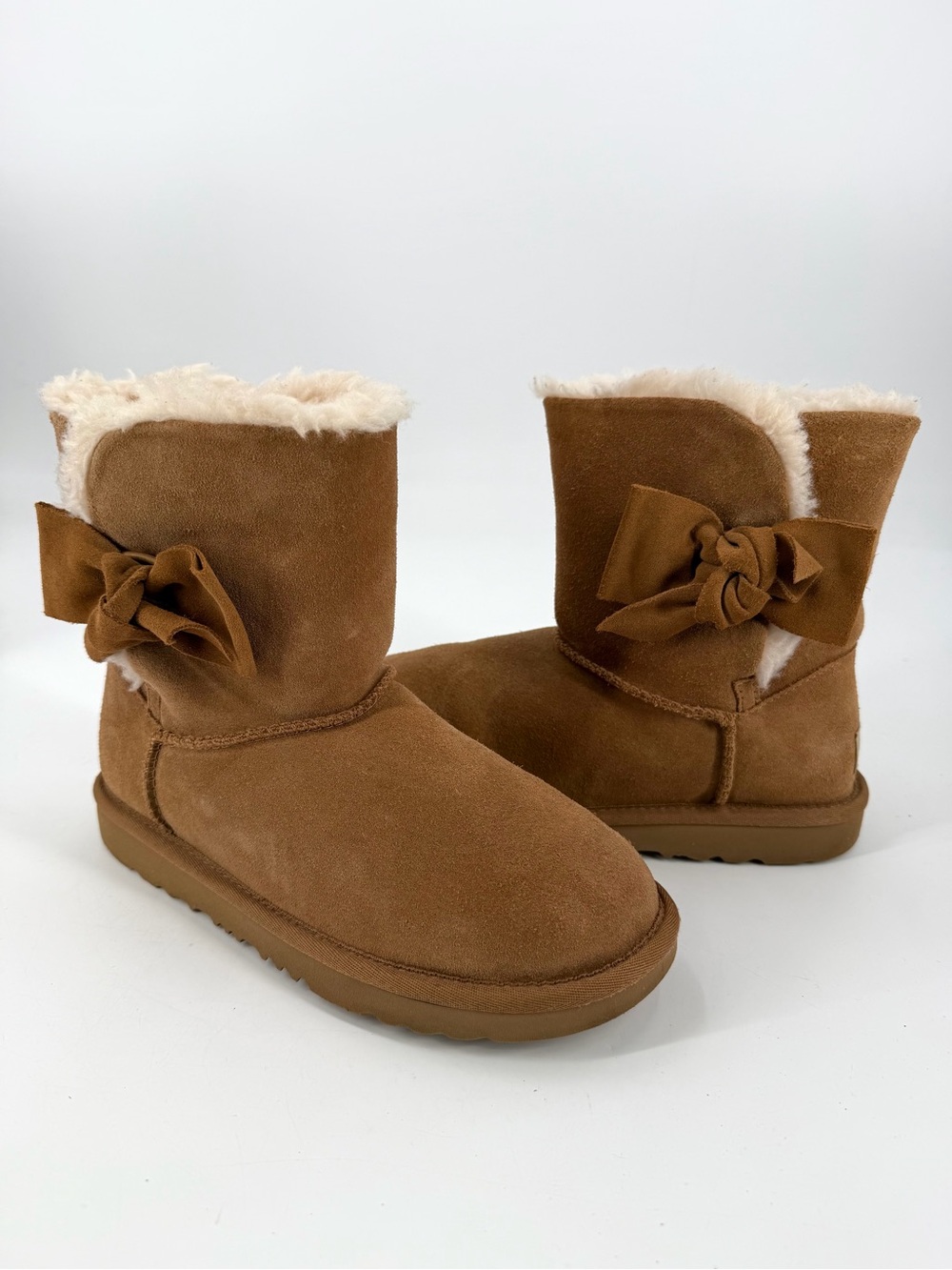 UGG Daelynn Chestnut Slip On Shearling Fur Leather Bow Boots